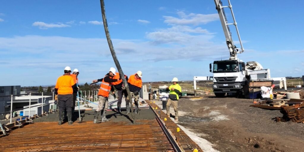 ARG Concrete supply truck delivering and pumping to a commercial foundation in Charlotte, NC
