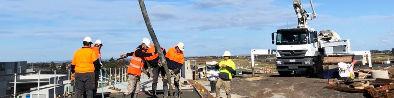 ARG Concrete supply truck delivering and pumping to a commercial foundation in Charlotte, NC